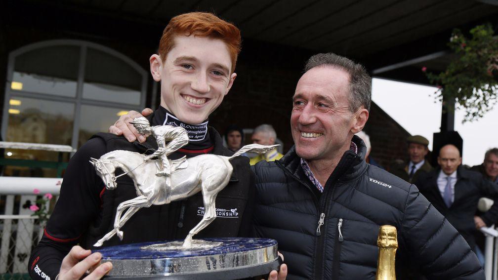 David Egan with his Champion Apprentice trophy as his father John looks on with pride