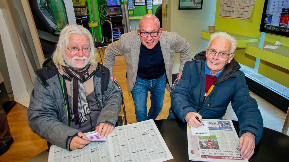 JenningsBet owner Greg Knight (centre) with two regulars at his Abbey Wood shop, Tony (left) and Andy (right)