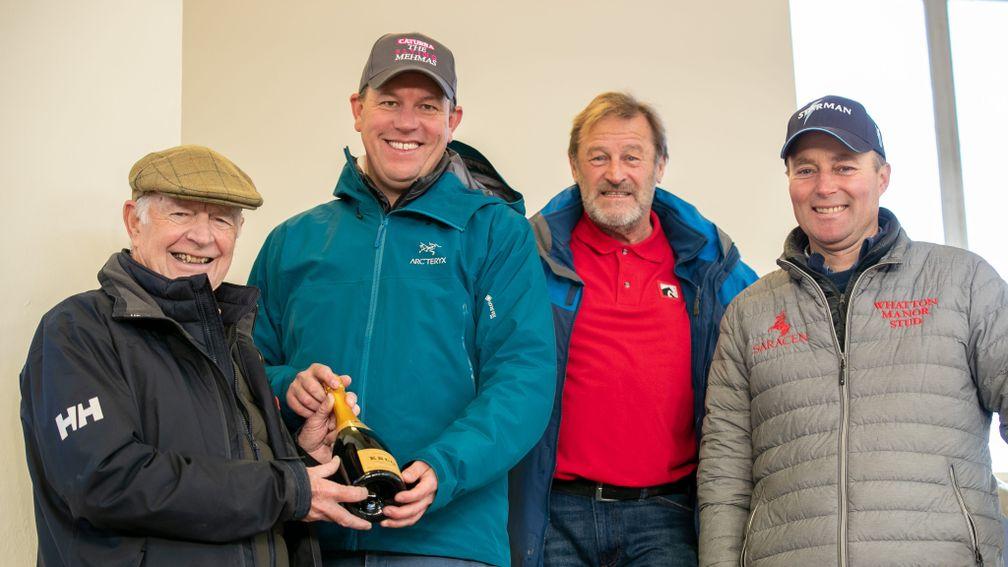 Geoffrey Howson (left) presents Richard Brown with a bottle of champagne for winning the Bloodstock Agent of The Year award alongside Desert Crown's breeder Gary Robinson and Ed Player of Whatton Manor Stud