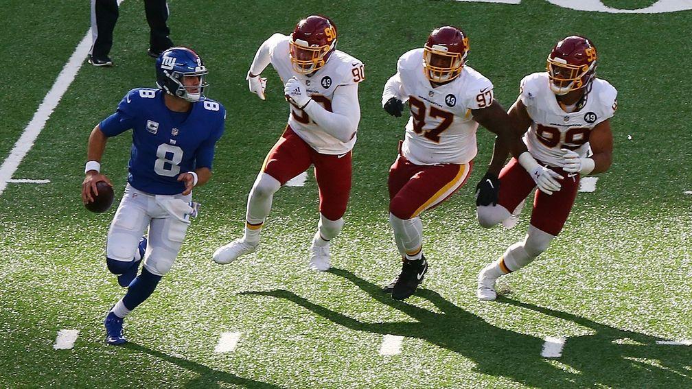New York Giants quarterback Daniel Jones scrambles out of the pocket against the Washington Football Team