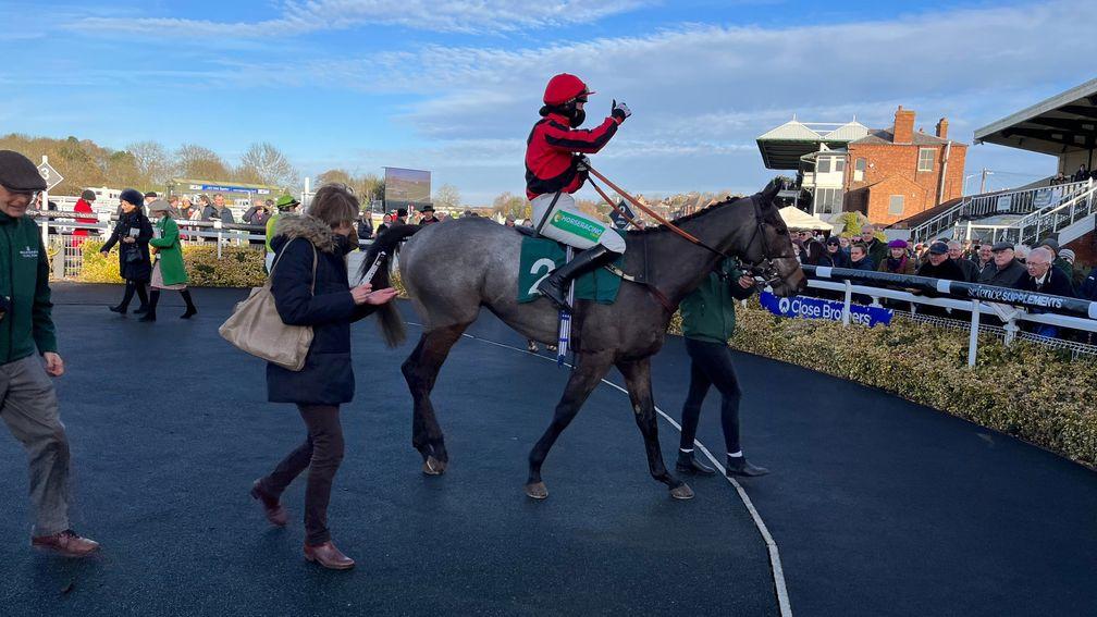 Bryony Frost gives a thumbs-up to the crowd after a warm reception following her victory aboard Graystone in the opener at Warwick