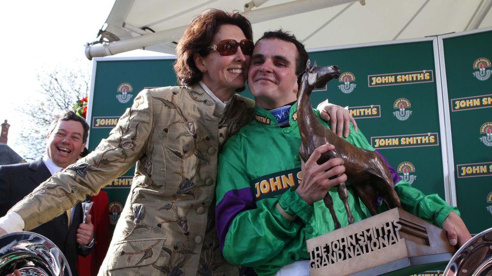 Venetia Williams gives Liam Treadwell a hug after Mon Mome's Grand National success