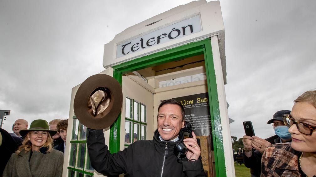Frankie Dettori poses in front of the famous Bellewstown phone box with Barney Curley's fedora