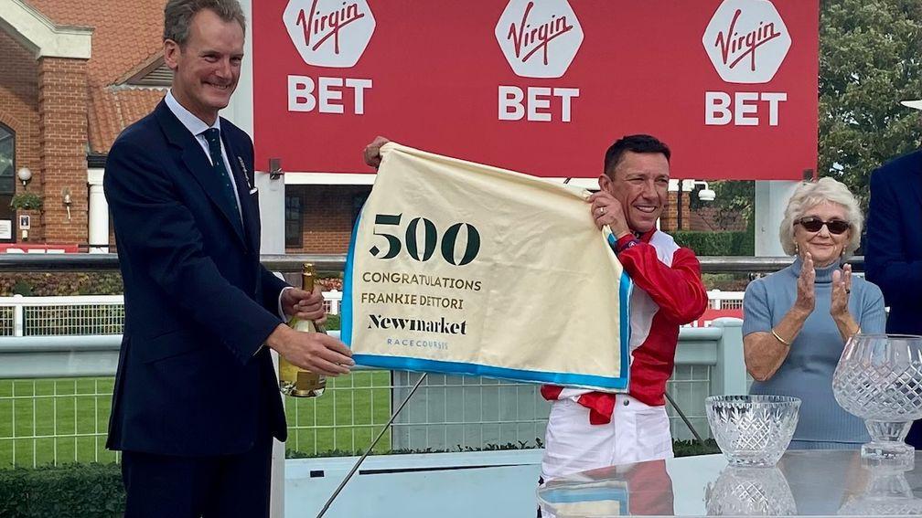 Frankie Dettori receives a 500 saddlecloth from Newmarket racecourse