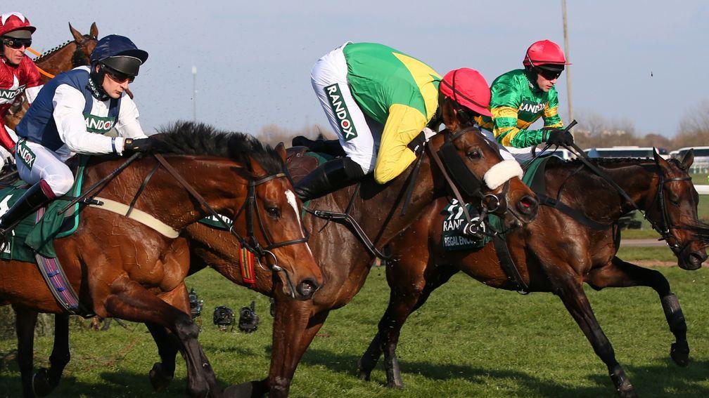 Clinging on: Paddy Kennedy does well to maintain the partnership with eventual runner-up Magic Of Light (red cap)