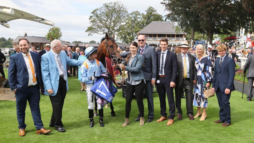 Copper Knight's owners, including Tom (fourth right), Tony (fifth right) and Keith Denham (second left), celebrate after victory in the Sky Bet And Symphony Handicap at York's Ebor festival this year
