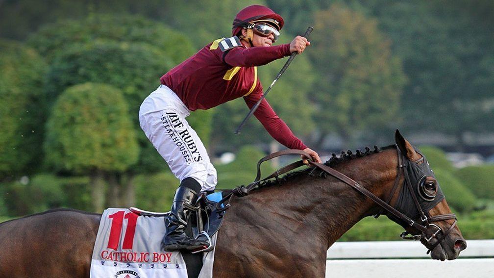 Javier Castellano punches the air as he wins the Grade 1 Travers Stakes on Catholic Boy at Saratoga