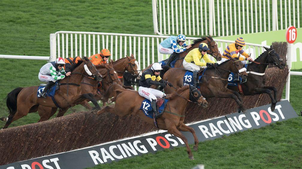 Tully East (yellow, number 13) jumps the last on the way to victory in the Close Brothers Novices' Handicap Chase