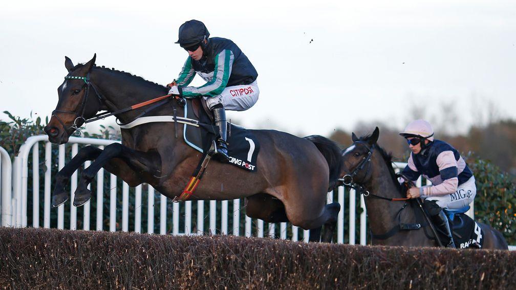 Altior gives an early fence plenty of height on the way to victory in the Henry VIII Novices' Chase at Sandown