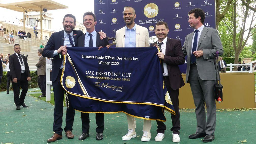 Former NBA star Tony Parker flanjked by breeder Henri Bozo (second left) and trainer Mikel Delzangles (right) after Mangoustine's victory in the Emirates Poule d'Essai des Pouliches