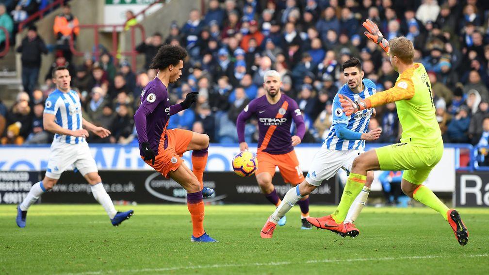 Leroy Sane scores the third goal in Manchester City’s 3-0 Premier League victory over Huddersfield