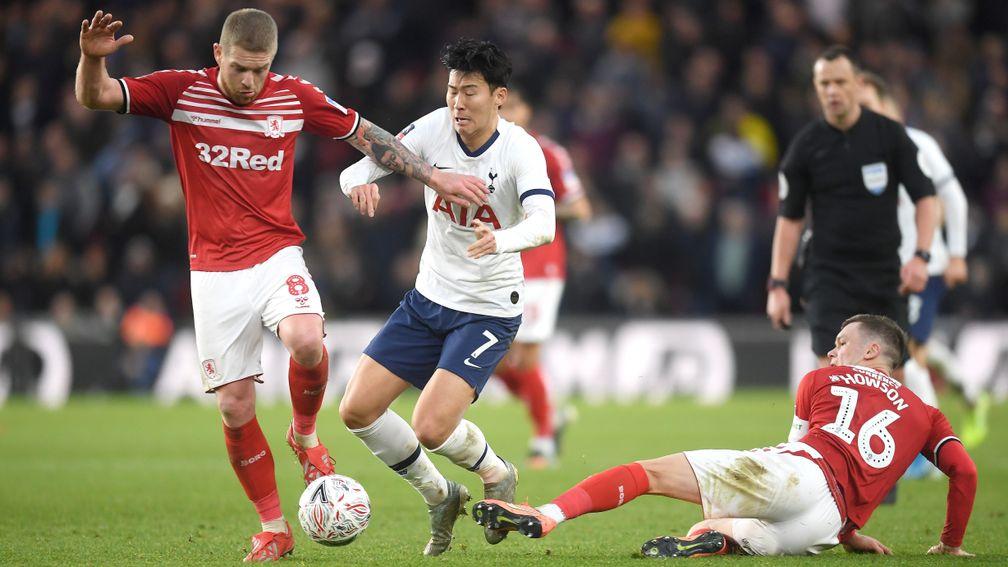 Heung-Min Son of Tottenham Hotspur is tackled by Adam Clayton and Jonny Howson of Middlesbrough