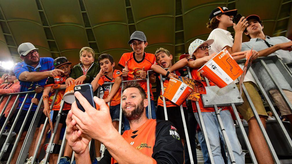 Andrew Tye takes a selfie with some Perth Scorchers fans
