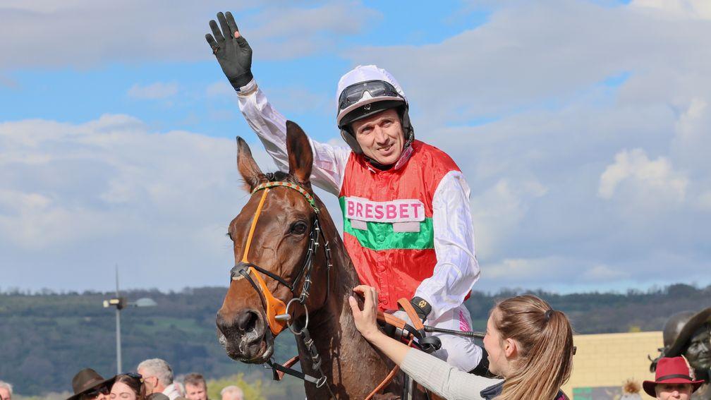 Paddy Brennan waves goodbye to the Cheltenham crowd after riding Manothepeople to victory