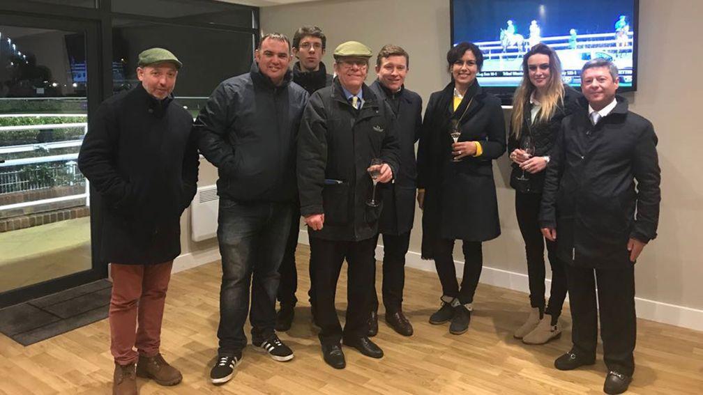 Paul Burgoyne (centre) celebrates Runaiocht’s success at Kempton with family and friends, including former jockey Richard Quinn (right)
