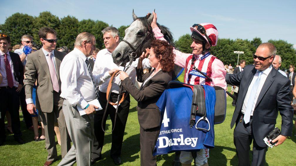 Clive Cox (right) greets Lethal Force as the son of Dark Angel returns to the winners' enclosure after landing the 2013 July Cup