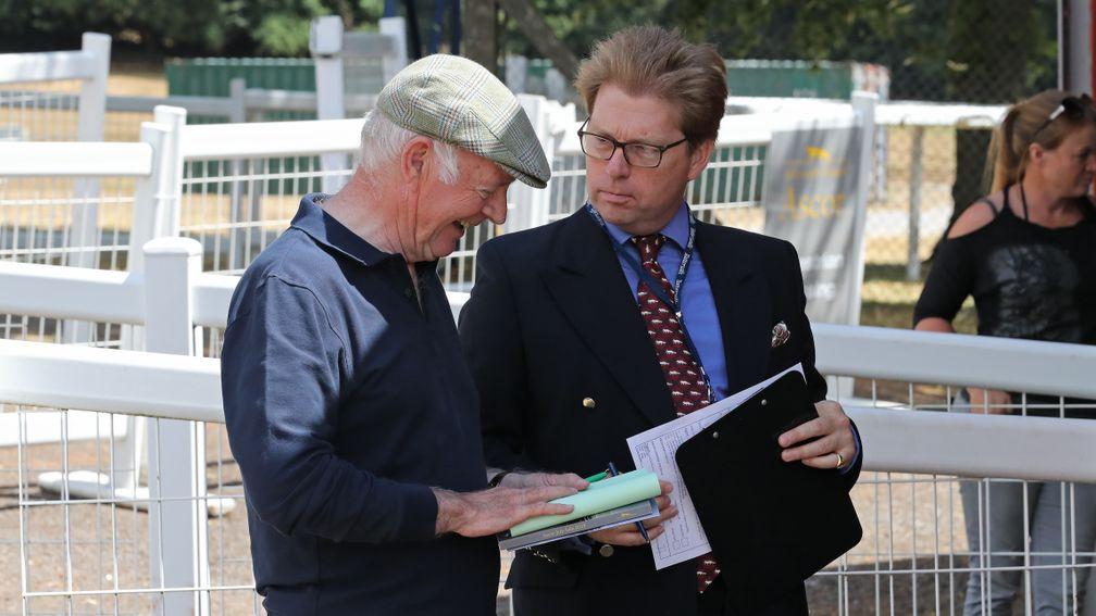 Geoffrey Howson (left) signs the docket for the sale-topping Showcasing filly