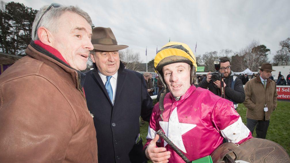 Sean Flanagan debriefs winning owner Michael O'Leary (left) and trainer Noel Meade after winning the Christmas Chase on Road To Respect