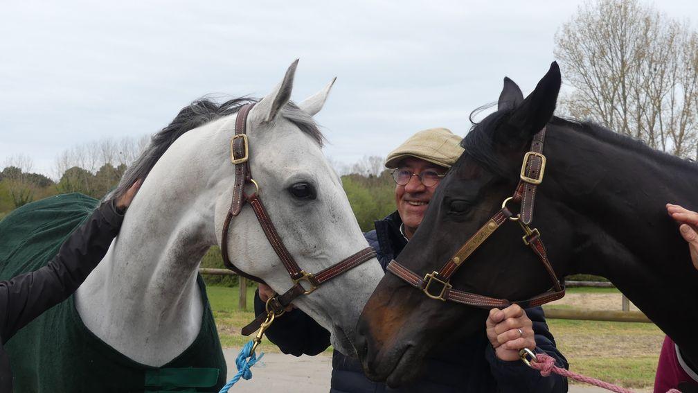 France's champion jumps trainer Francois Nicolle poses with stable stars Bipolaire and De Bon Coeur