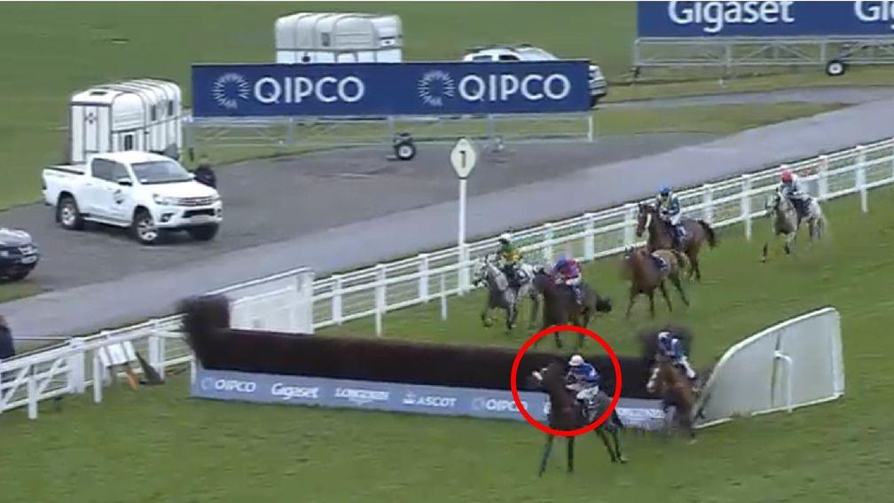 Diego Du Charmil just about jumps the fence, but Capeland is sandwiched between the fence and plastic rail