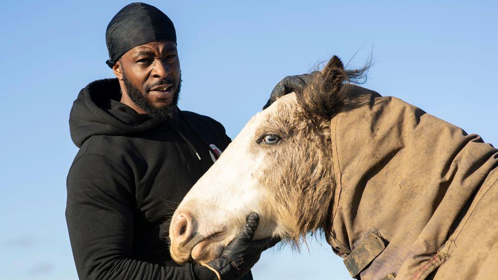 Freedom Tariq otherwise known as Fr33dom the founder of The Urban Equestrian Academy in the paddock with one of his horses at Scraptoft Hill Farm near Leicester 15.12.20Pic: Edward Whitaker