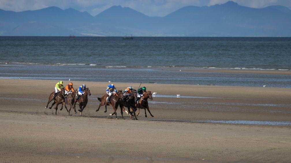 Waqaas (Lisa O'Neill, orange colours) holds off all-comers to win on the beach at Laytown last year