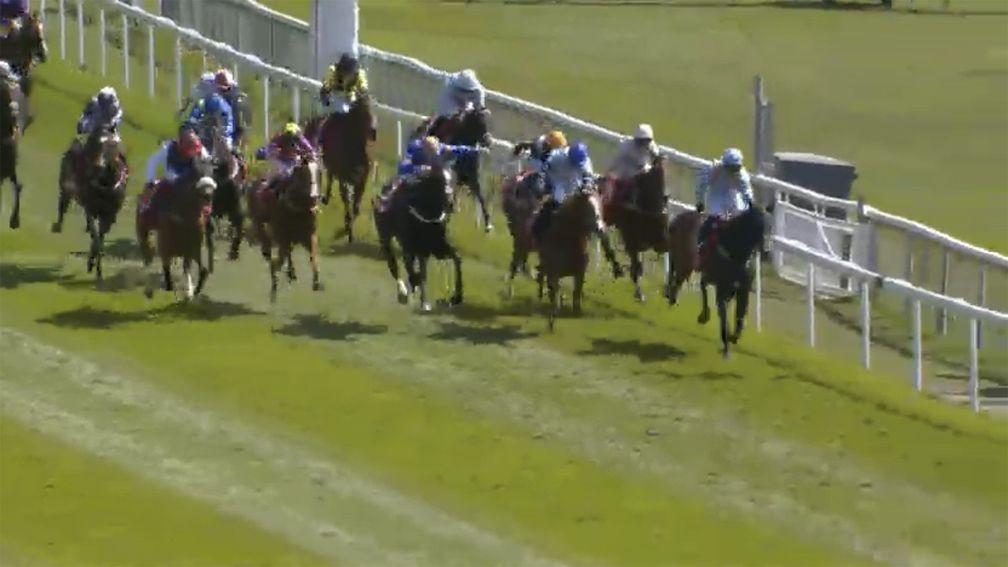 Dettori and Falcon Eight (left) start to bear down on the leaders up the home straight