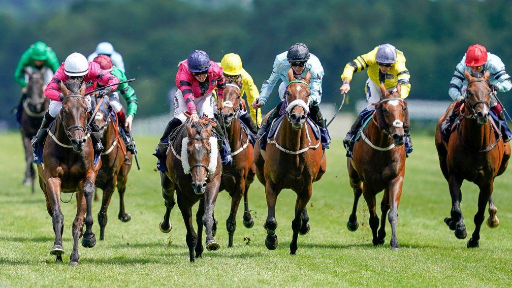 ASCOT, ENGLAND - AUGUST 07: Nicola Currie riding Just Hubert (pink, white cap) win TheDubai Duty Free Shergar Cup Stayers during the Dubai Duty Free Shergar Cup meeting at Ascot Racecourse on August 07, 2021 in Ascot, England. (Photo by Alan Crowhurst/Get