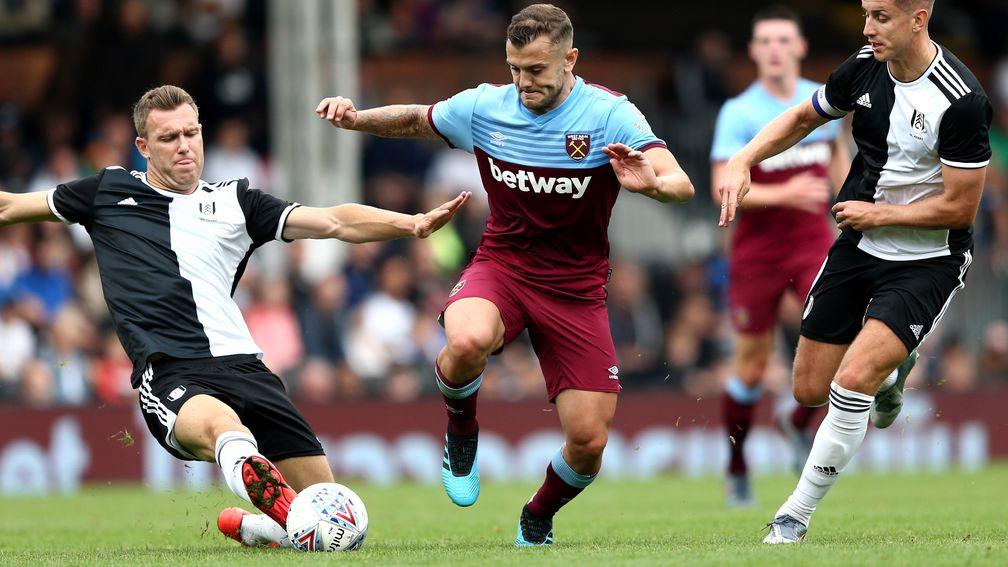 Fulham's Kevin McDonald tackles West Ham's Jack Wilshere in a pre-season friendly at Craven Cottage