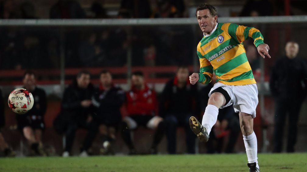 Sir AP McCoy: takes a shot on goal against the Cheltenam Town Legends