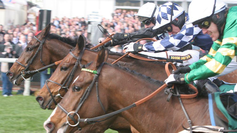 Noel Fehily (centre) gets the better of a close finish with Richard Johnson (far side) and Tony McCoy