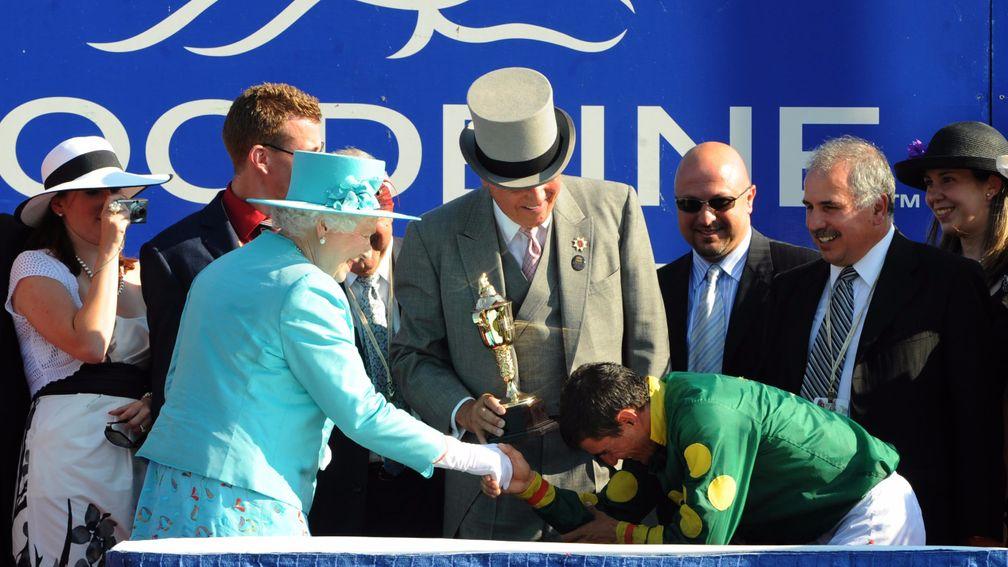 The Queen presents Eurico Rosa Da Silva with the Queen's Plate at Woodbine in 2010.