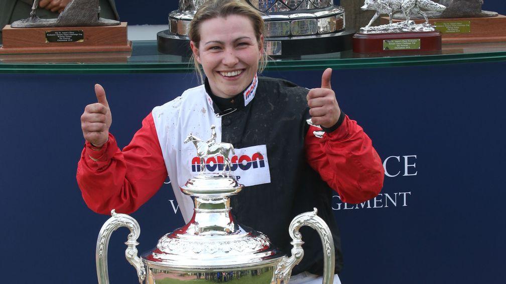 A delighted Harriet Tucker poses with the trophy for the Foxhunter Chase