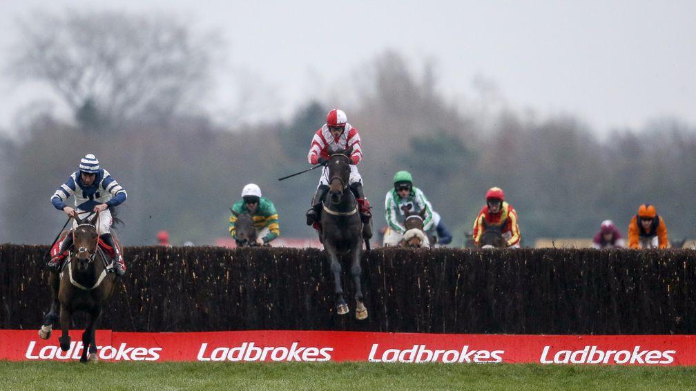 NEWBURY, ENGLAND - DECEMBER 02: Paul Townend riding Total Recall (C, red) clear the last to win The Ladbrokes Trophy Steeple Chase from Whisper (L) at Newbury racecourse on December 2, 2017 in Newbury, United Kingdom. (Photo by Alan Crowhurst/Getty Images