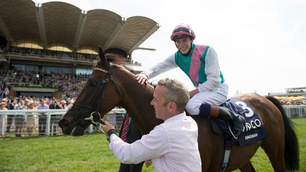 Happier days: Michael Curran leads Kingman and James Doyle in front of the stands after the 2014 Sussex Stakes at Goodwood