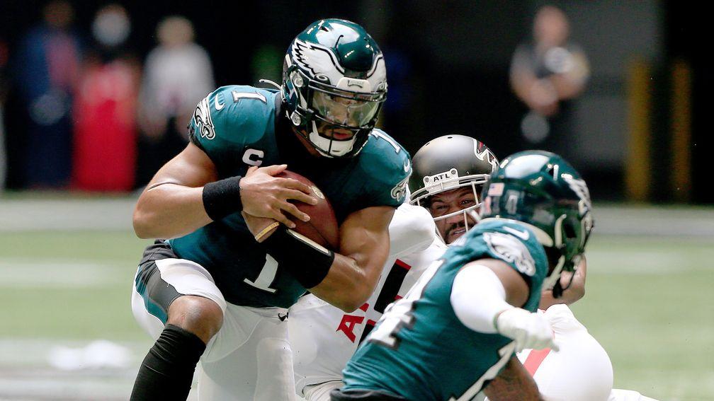 Jalen Hurts protects the ball for the Philadelphia Eagles