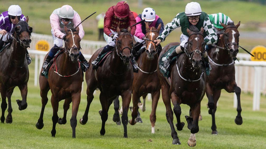The Lir Jet (maroon) was promoted to second over Aloha Star (pink) following a stewards' inquiry to the Keeneland Phoenix Stakes