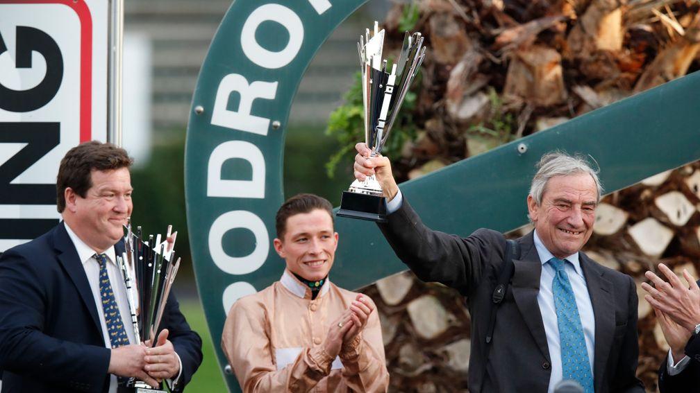 Luca Cumani holds the trophy aloft alongside winning rider Jason Watson following their victory with God Given in the Group 1 Premio Lydia Tesio Sisal Matchpoint