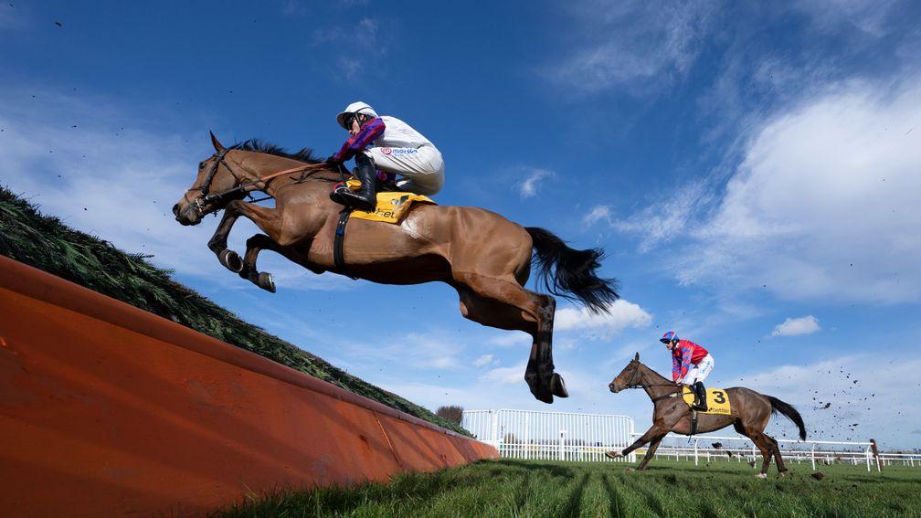 Bravemansgame (Harry Cobden) fly over the open ditch when landing the 2m 7.5f novices handicap chaseNewbury 12.2.22 Pic: Edward Whitaker