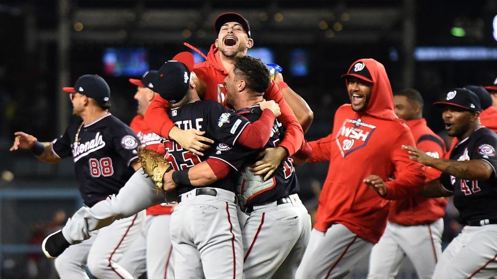 The Washington Nationals celebrate the final out of the tenth inning to defeat the LA Dodgers