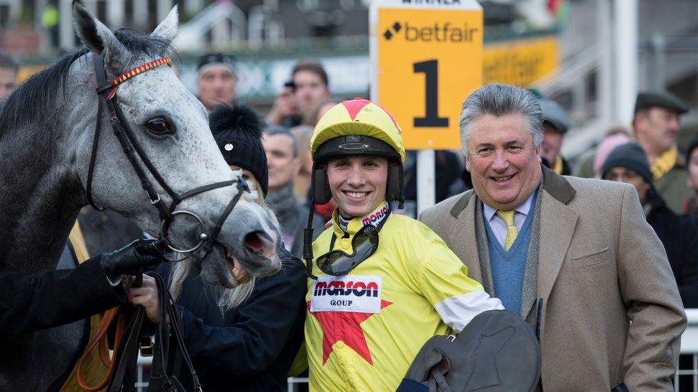 Harry Cobden and Paul Nicholls celebrate their Tingle Creek victory with Politologue