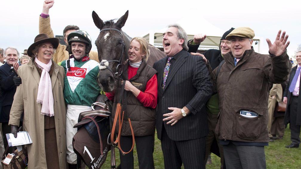Jubilation in the winner’s enclosure at Newbury as Denman’s joint owner Harry Findlay (arm raised) celebrates Hennessy success with jockey Ruby Walsh, groom Lucinda Gould and trainer Paul Nicholls