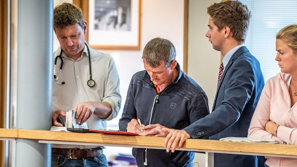Mick Murphy of Longways Stables signs the docket for the £170,000 Muhaarar filly out of Fig Roll