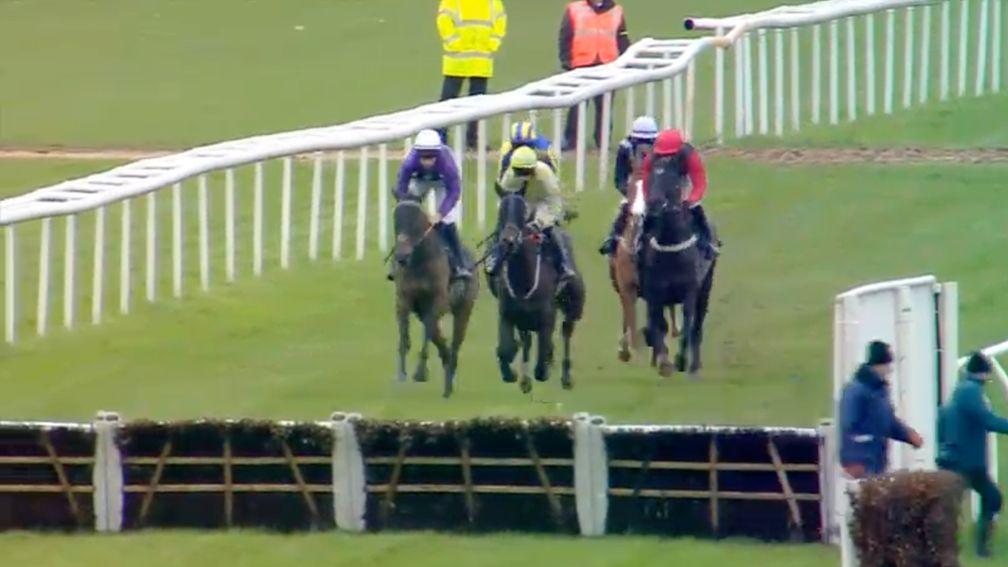 Just in time: the groundstaff are out the way as the runners almost reach the hurdle