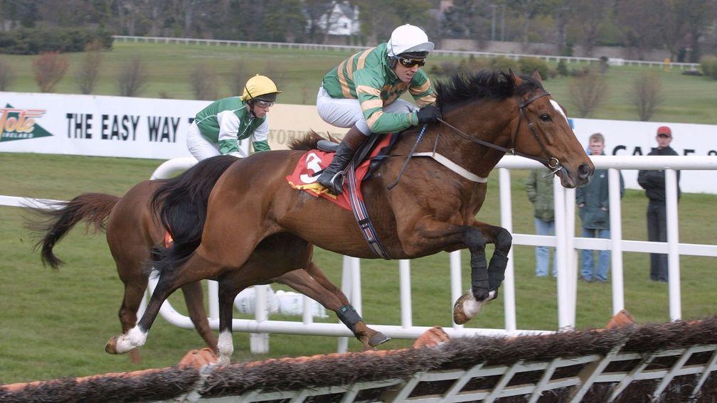 Charlie Swan: pictured here winning on Istabraq at Leopardstown in 2001, rode his first winner at Naas in 1983