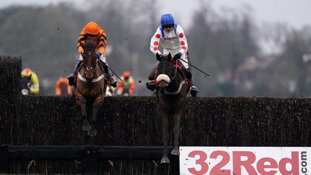 Clan Des Obeaux (right) heads Thistlecrack at the last in the King George VI Chase at Kempton