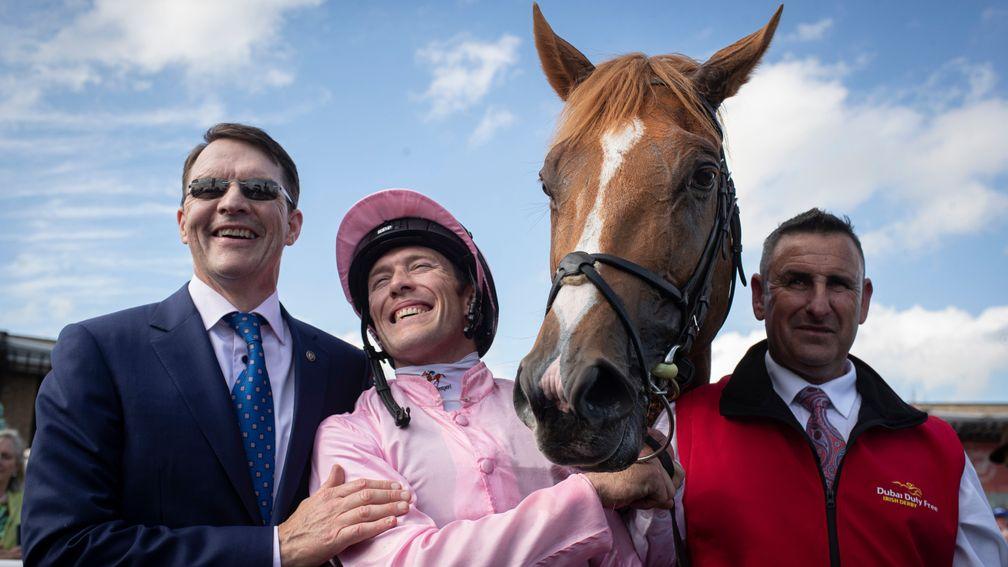 Aidan O'Brien, Padraig Beggy and groom Michael Hinchey are all smiles after the success of Sovereign in the Irish Derby