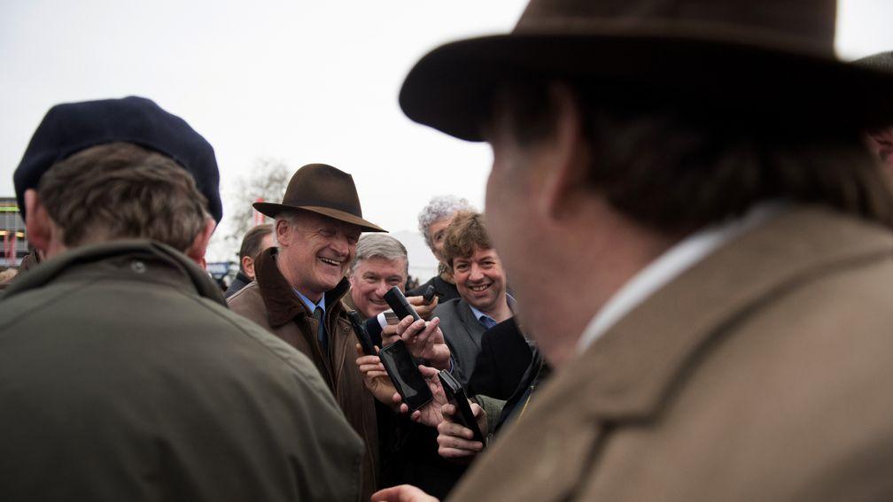 Nicky Henderson goes to congratulate winning trainer Willie Mullins