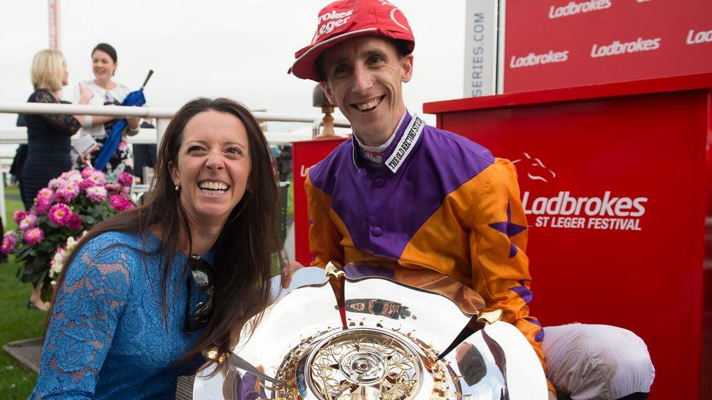 Where did you get that hat?: George Baker celebrates the 2016 St Leger win of Harbour Law with trainer Laura Mongan