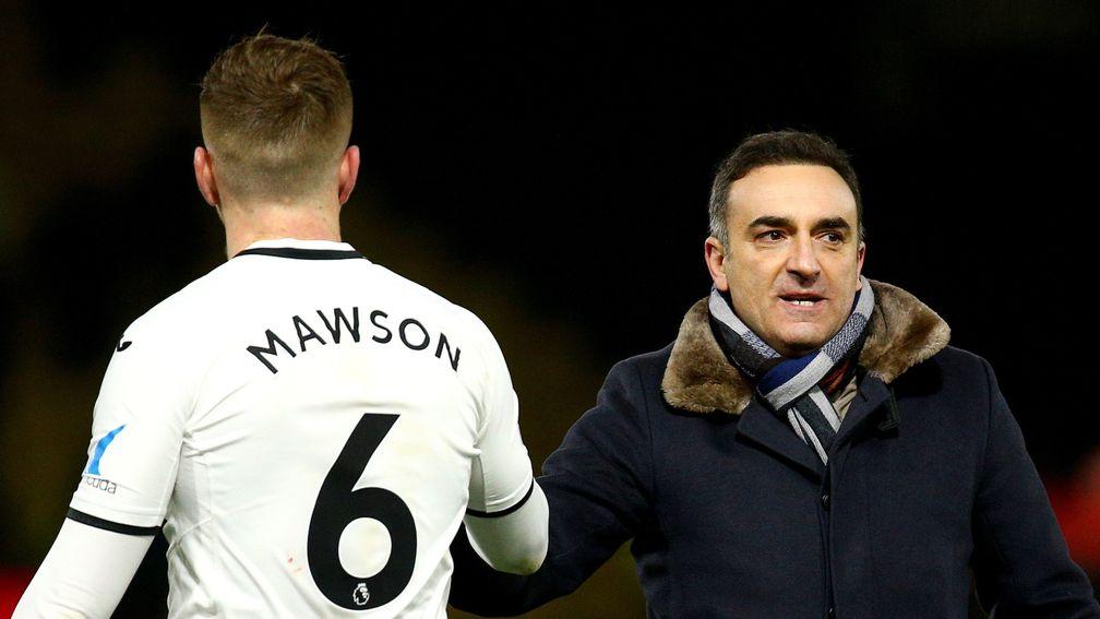 Swansea Manager Carlos Carvalhal celebrates his team's win with Alfie Mawson